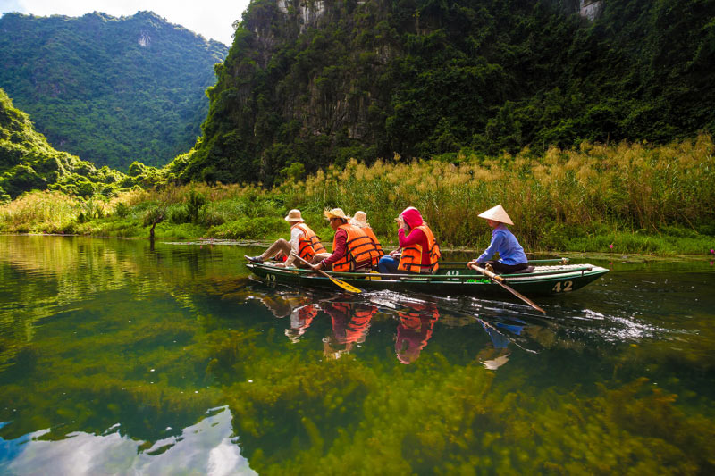 Taking a boat ride on the Ngo Dong river