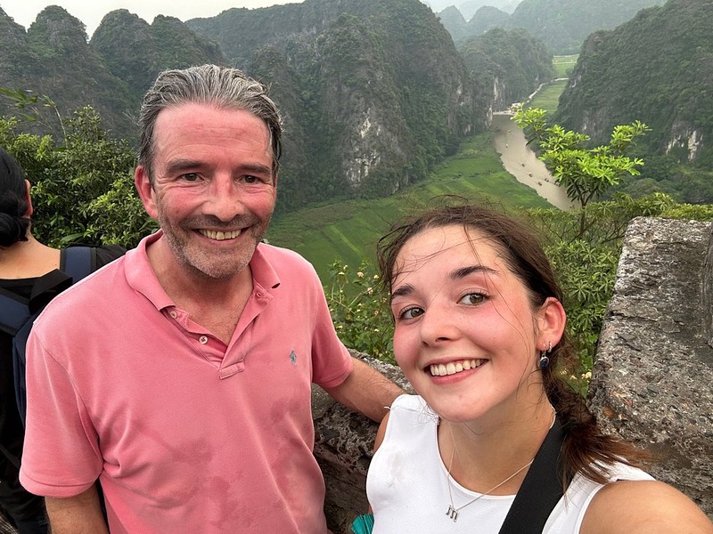 Kampá Tour traveler selfie at the peak of Tam Coc