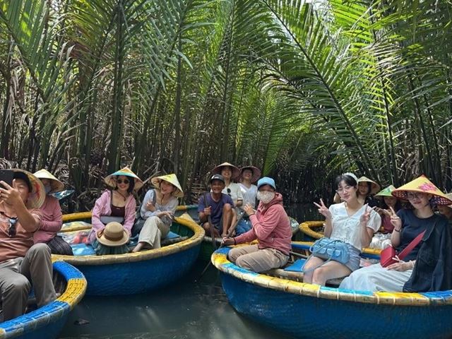 Boat ride around the coconut forest of Bay Mau