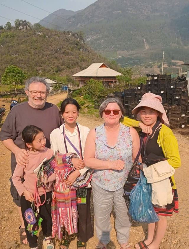 They share a joyful moment with local villagers in Sapa